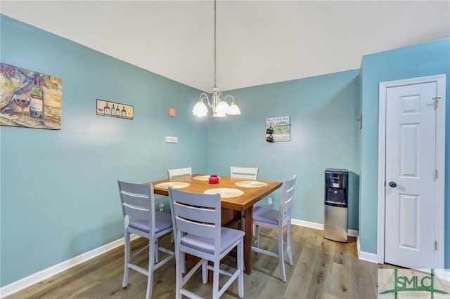 dining space featuring a chandelier and hardwood / wood-style flooring