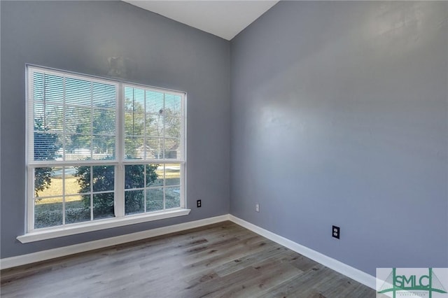 empty room with light hardwood / wood-style floors