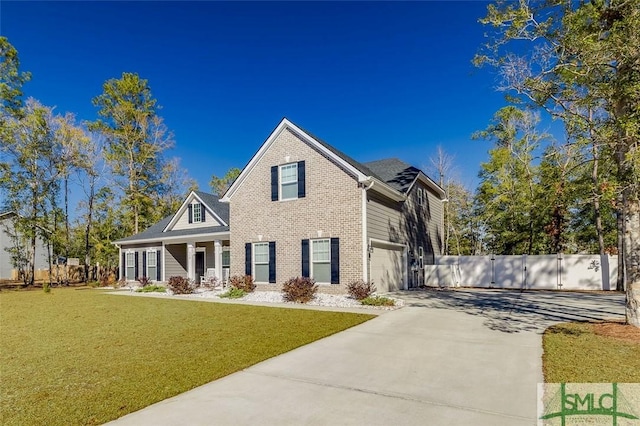 view of front of property featuring a garage and a front yard