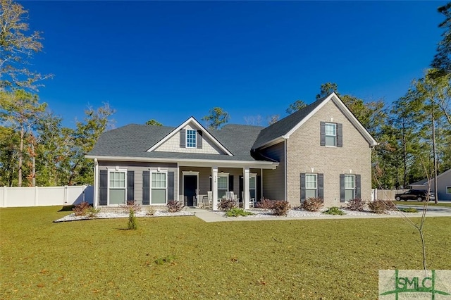 view of front of home with a porch and a front lawn