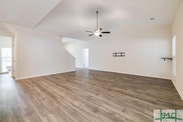 unfurnished living room with ceiling fan, vaulted ceiling, and hardwood / wood-style flooring