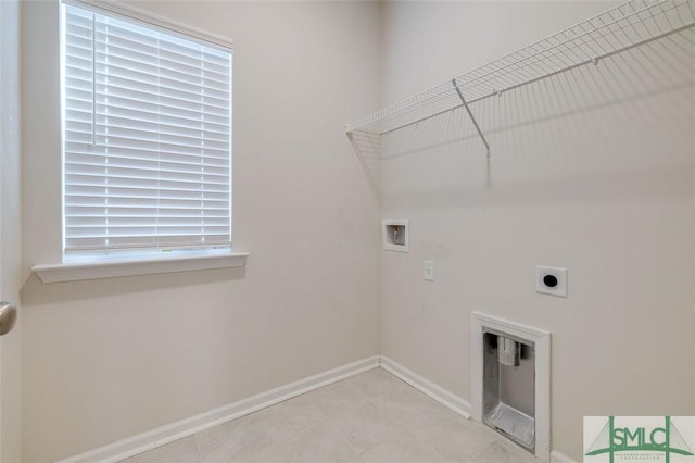 clothes washing area with hookup for an electric dryer and hookup for a washing machine