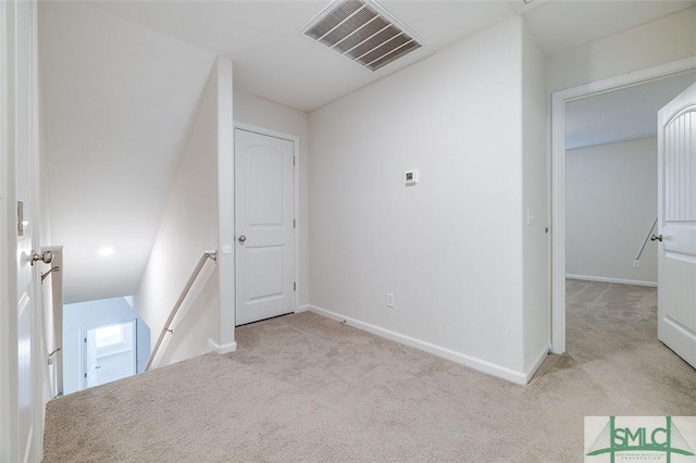 unfurnished bedroom with light colored carpet