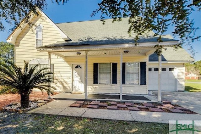 view of front of home featuring a porch and a garage