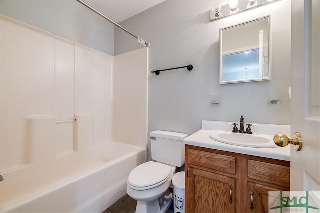 full bathroom featuring shower / bathing tub combination, vanity, and toilet