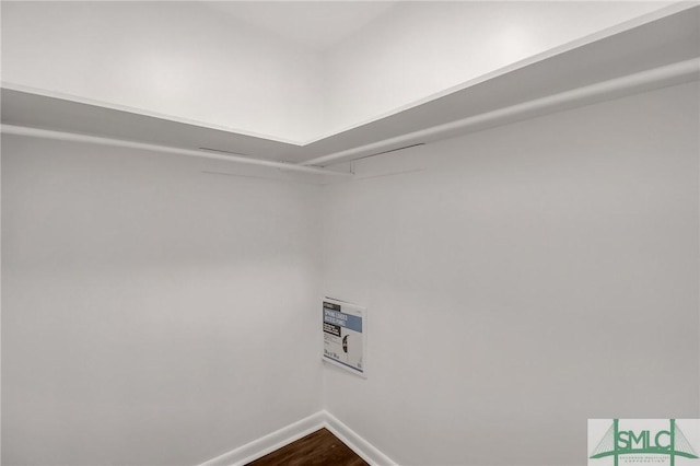 walk in closet featuring hardwood / wood-style flooring