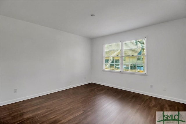 unfurnished room featuring dark hardwood / wood-style floors