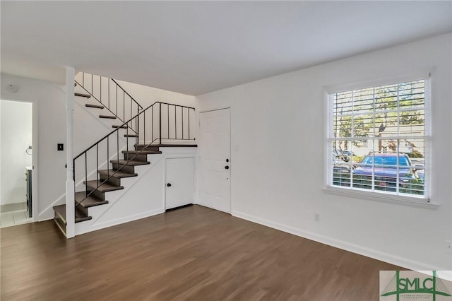 entrance foyer with dark hardwood / wood-style flooring