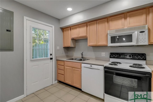 kitchen with light brown cabinets, white appliances, sink, and electric panel