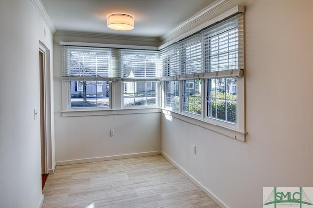 empty room featuring ornamental molding