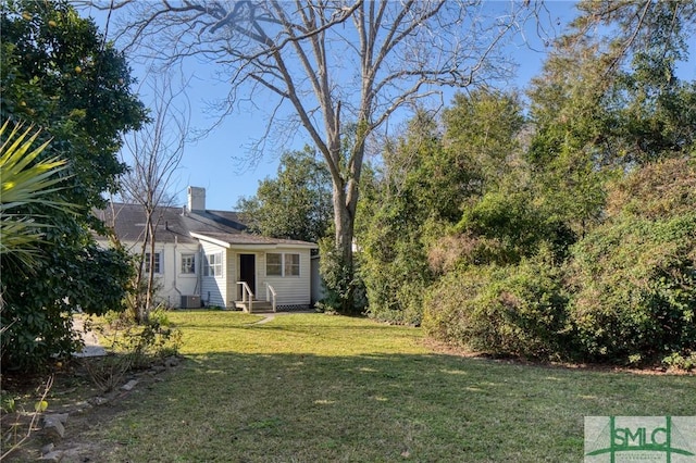 view of yard featuring central AC