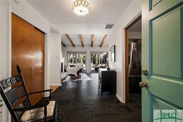 hallway with beamed ceiling