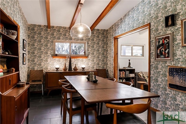 tiled dining area with beamed ceiling