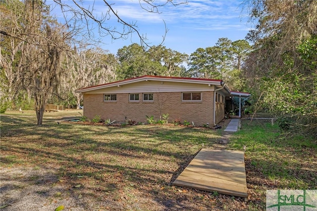 view of property exterior featuring a yard