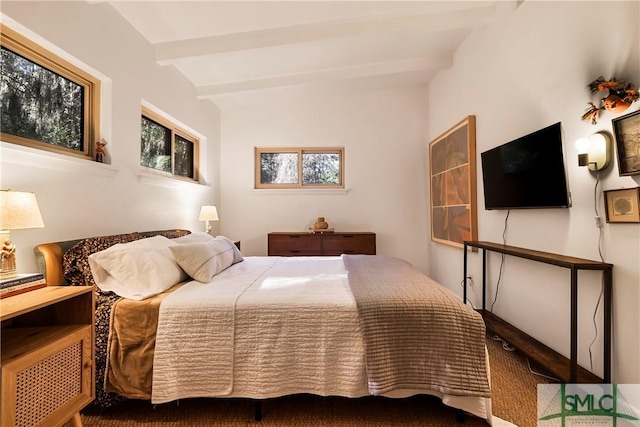 bedroom featuring beamed ceiling