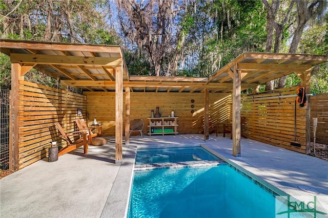 view of pool with an in ground hot tub and a patio area