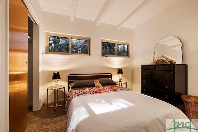 bedroom featuring vaulted ceiling with beams and carpet floors