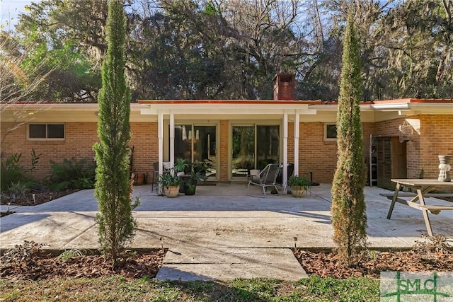 back of house with a patio