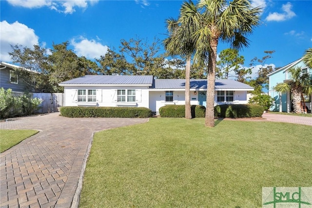 ranch-style home with a front yard