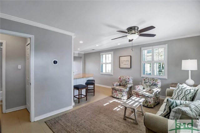 living room featuring ceiling fan and crown molding