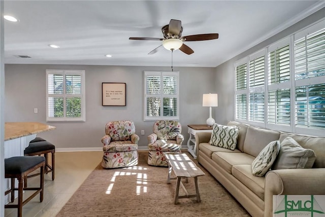 living room featuring ceiling fan and light tile patterned flooring