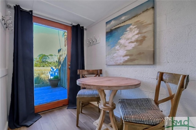 dining space featuring hardwood / wood-style floors and a wealth of natural light