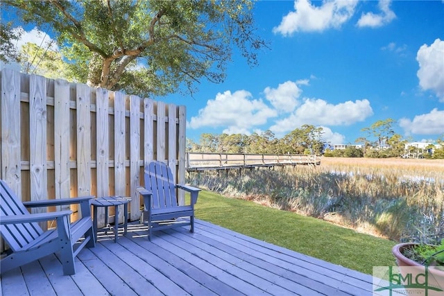 wooden terrace with a yard