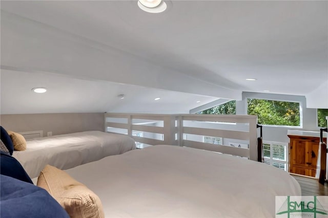 bedroom featuring vaulted ceiling with beams