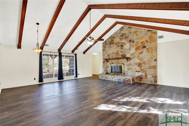 unfurnished living room with beam ceiling, ceiling fan, dark wood-type flooring, a stone fireplace, and high vaulted ceiling