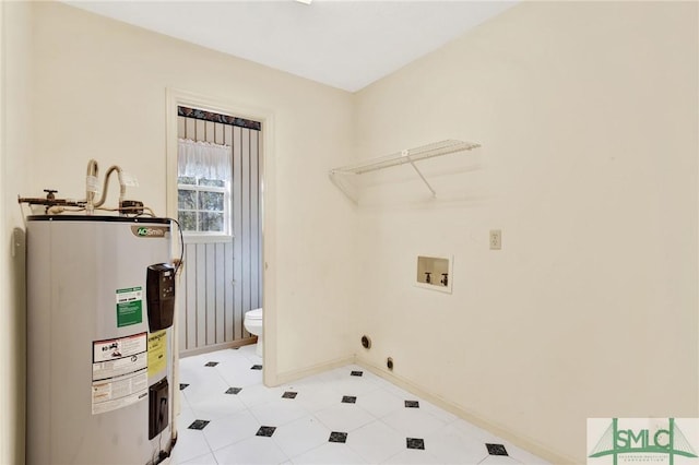 laundry room with hookup for an electric dryer, hookup for a washing machine, and water heater