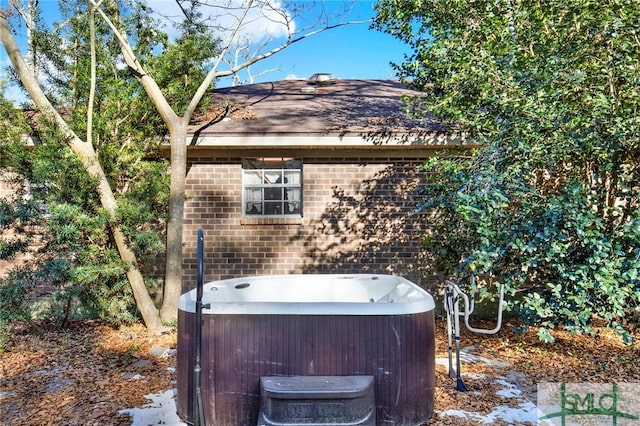 exterior space with a hot tub and cooling unit