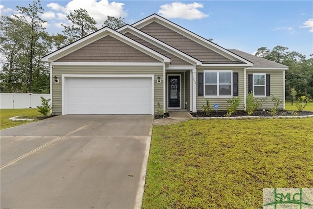 view of front of house featuring a front yard and a garage