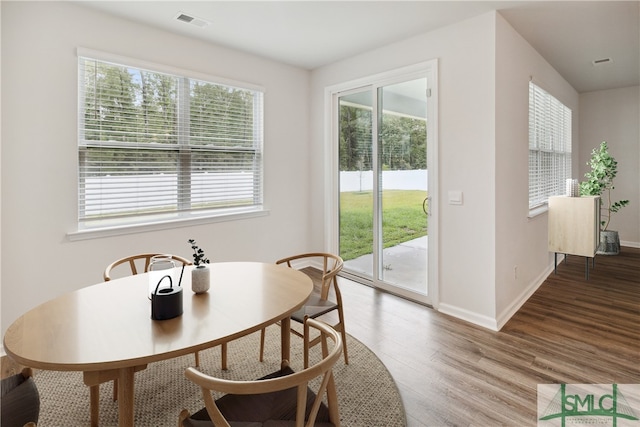 dining area featuring wood-type flooring