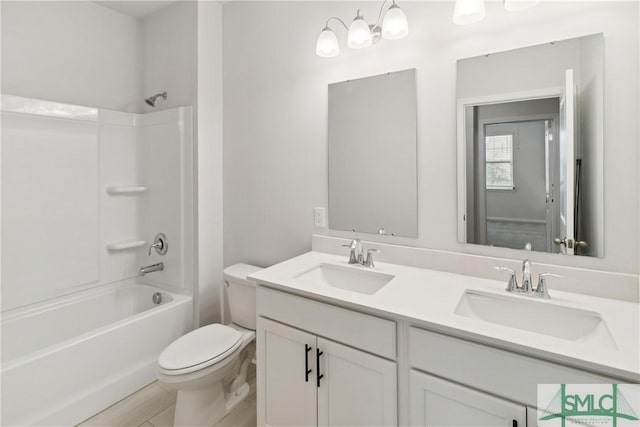 full bathroom with vanity, shower / bathing tub combination, and toilet