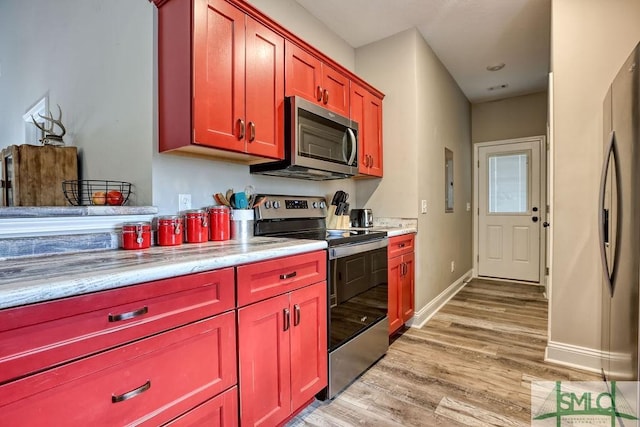 kitchen featuring stainless steel appliances and light wood-type flooring