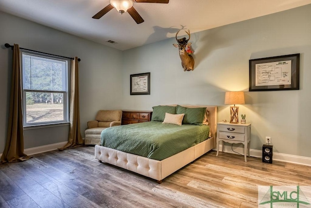 bedroom featuring ceiling fan and light hardwood / wood-style flooring