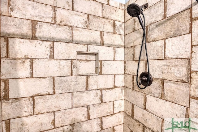 details featuring a tile shower