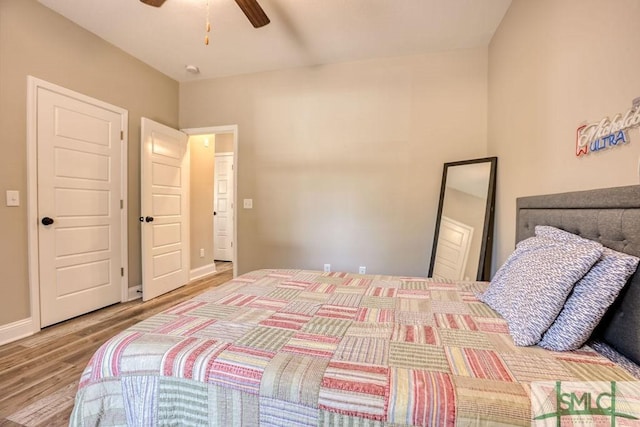 bedroom with ceiling fan and hardwood / wood-style floors