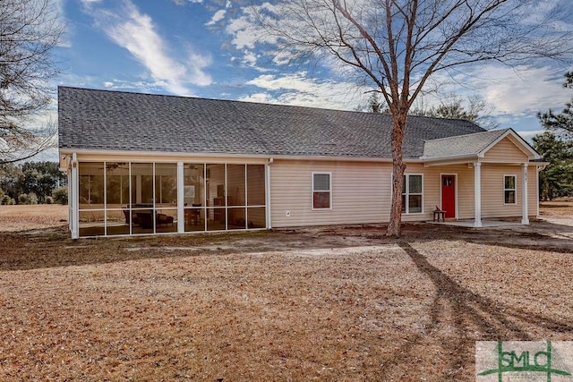 back of property featuring a sunroom and a patio area