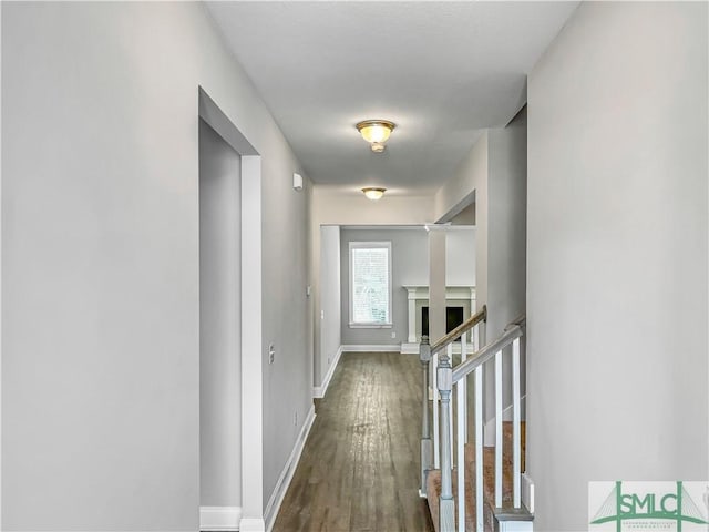 hall with dark hardwood / wood-style flooring