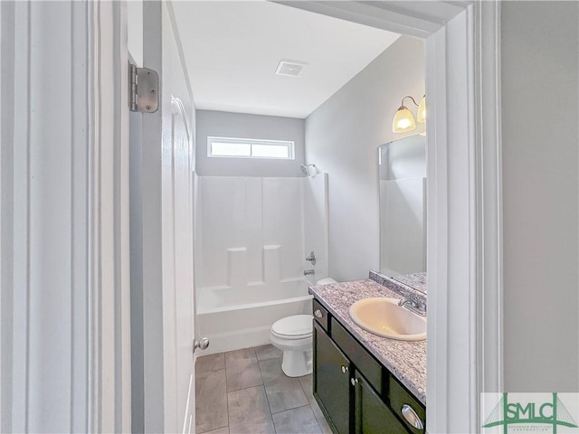 full bathroom featuring tile patterned floors, vanity,  shower combination, and toilet