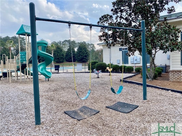 community jungle gym featuring fence