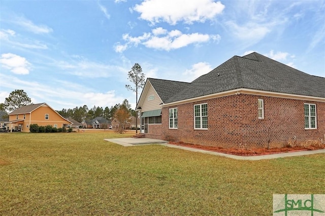 view of home's exterior featuring a yard and a patio