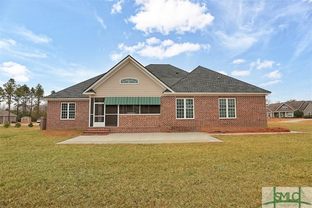 back of house featuring a yard and a patio area