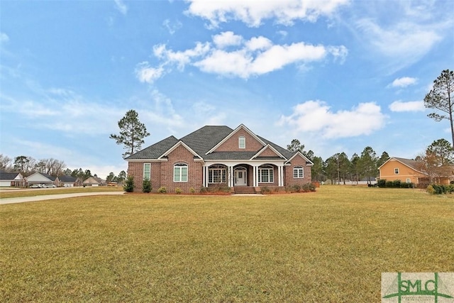 craftsman-style house featuring a front yard