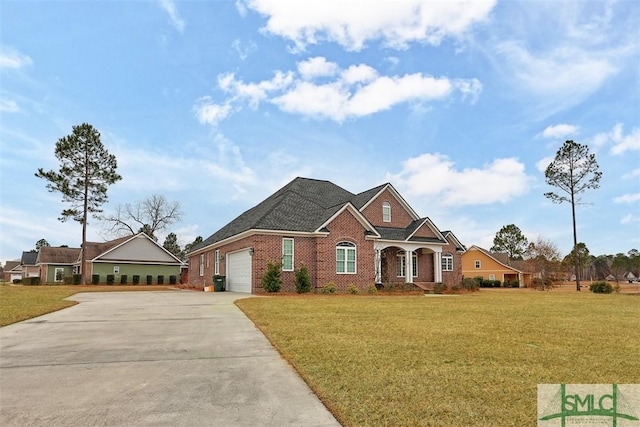 view of front of property featuring a front lawn and a garage