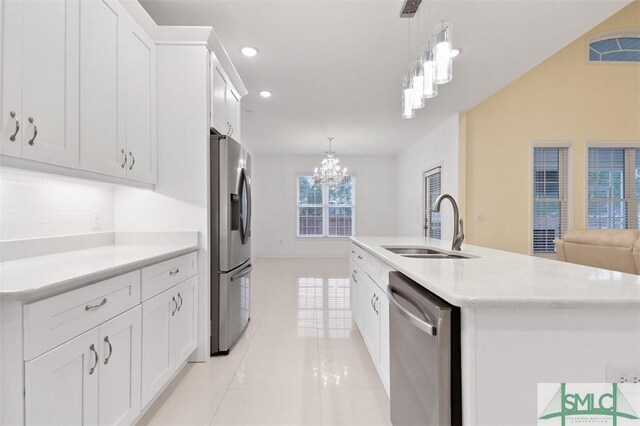 kitchen with sink, white cabinetry, an island with sink, and appliances with stainless steel finishes