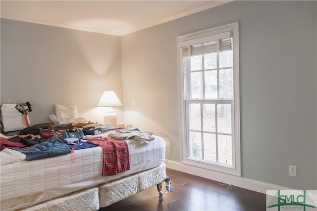 bedroom with dark hardwood / wood-style floors, ornamental molding, and multiple windows