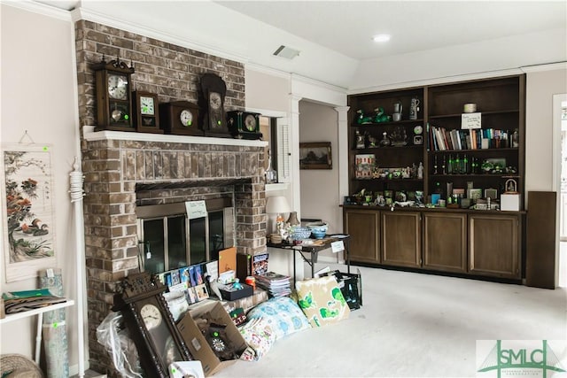 bar featuring dark brown cabinets, ornamental molding, and a brick fireplace