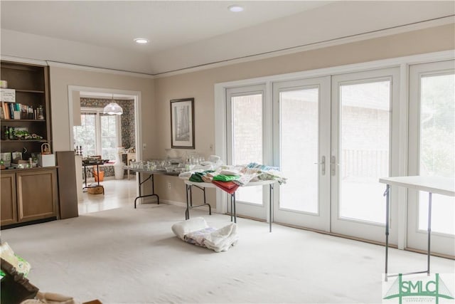 interior space with light carpet and french doors